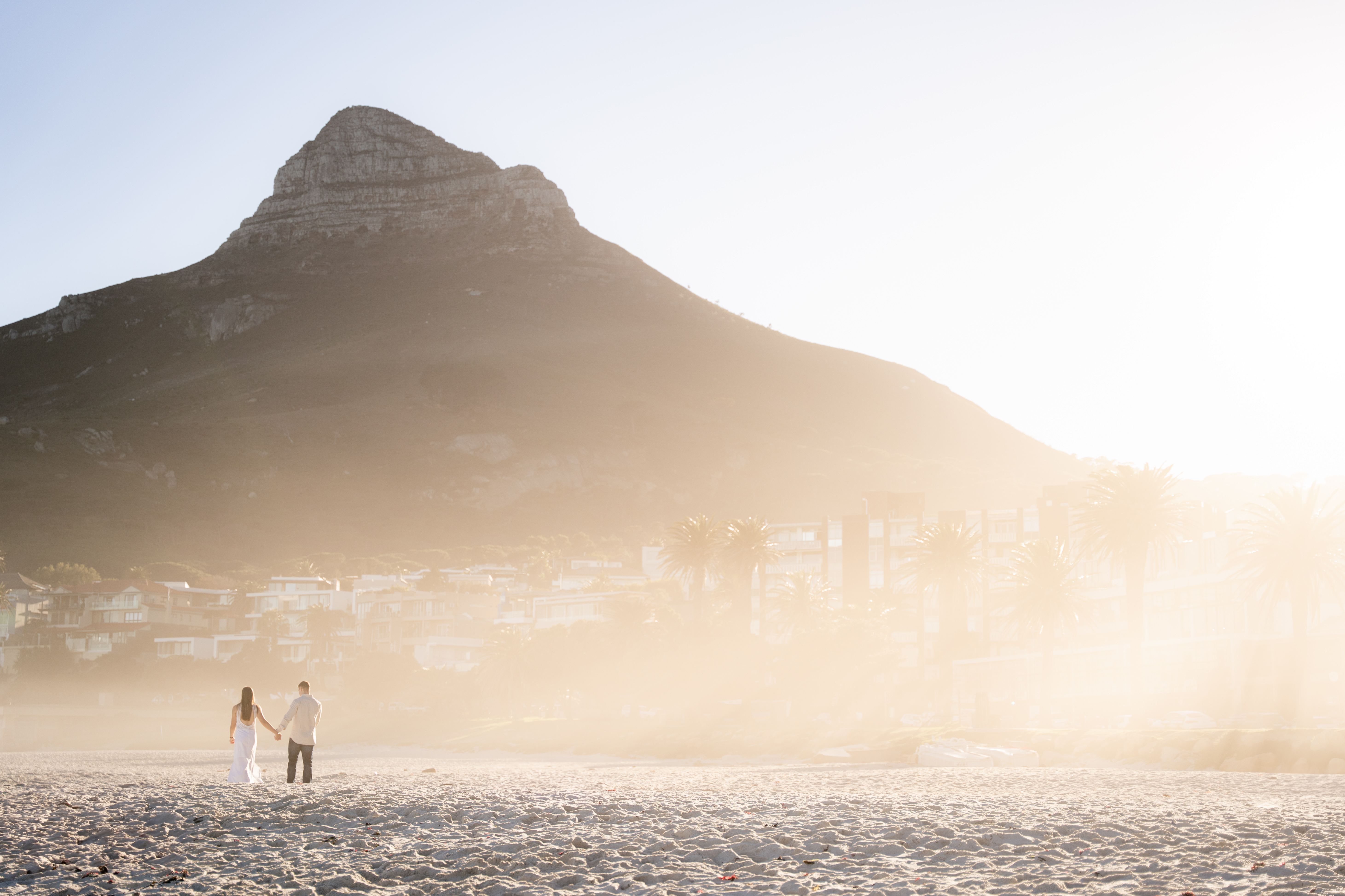 A couple at Camps Bay, Lion's Head behind