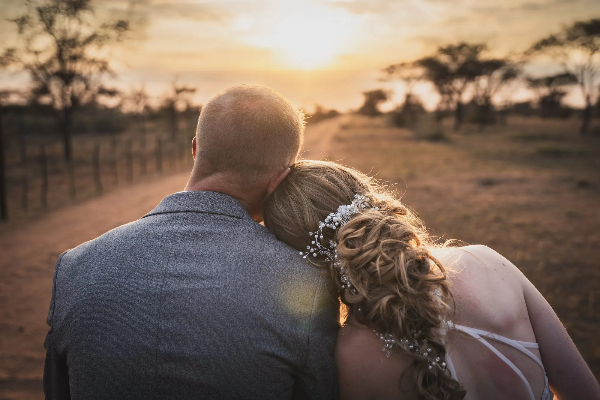 A couple cheek to cheek as the Namibian sun goes down